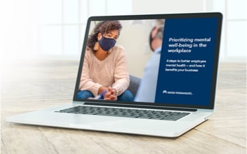 Laptop showing two people in masks having a serious conversation with adjacent text which reads Prioritizing mental well-being in the workplace