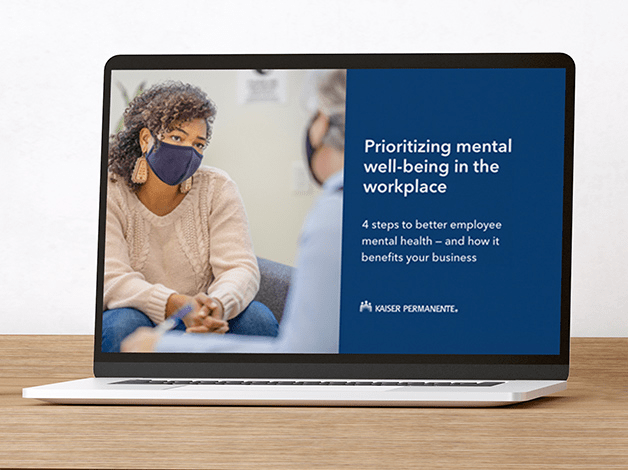 Laptop showing two people in masks having a serious conversation with adjacent text which reads Prioritizing mental well-being in the workplace