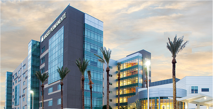 Modern Kaiser Permanente buildings with palm trees in front of them